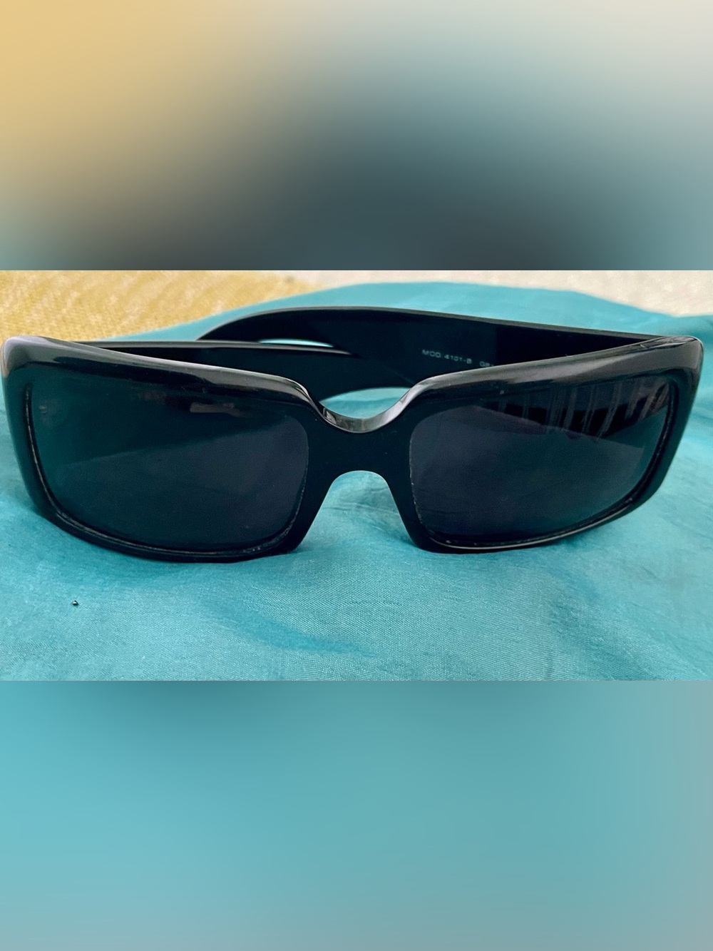 Rectangular black framed vintage sunglasses with dark lenses. Good condition